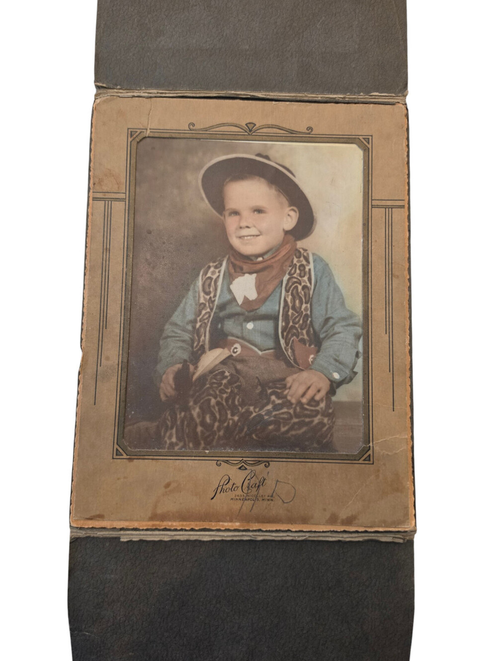 Vintage 1930s sepia-toned or hand-tinted portrait photograph Cowboy Boy